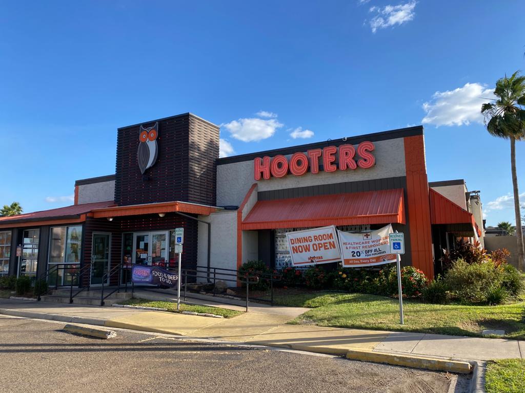 Revitalized Hooters' exterior with high-impact signage, reinforcing brand identity and enhancing curb appeal.
